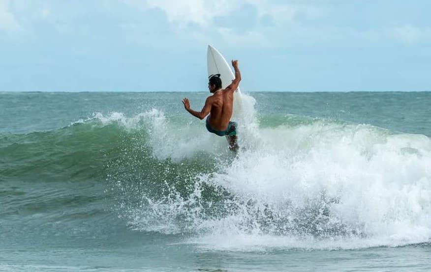 A man is surfing 